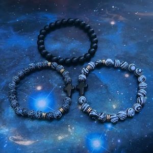 black bracelet, zebra looking bracelet with cross,blue Rocky bracelet with cross